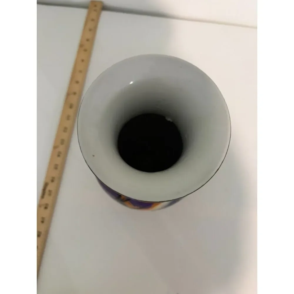 japanese vase with dark blue and pink ground, featuring birds